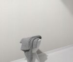Non-woven backed vinyl wallpaper in white tone