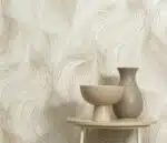 Non-woven beige wallpaper with repeated motif and vinyl surface