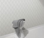 Patterned gray vinyl wallpaper on non-woven backing
