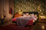 Green vinyl wallpaper with non-woven backing and pattern repeat