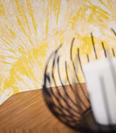 Yellow non-woven vinyl wallpaper with vibrant pattern